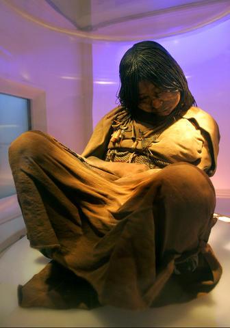 a mummified incan girl is displayed at the high