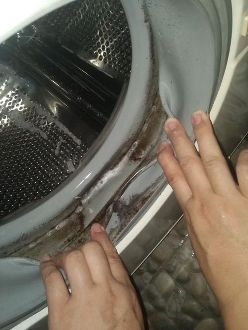 滚筒洗衣机外侧门内塑料圈上的污渍怎么洗也洗不掉
