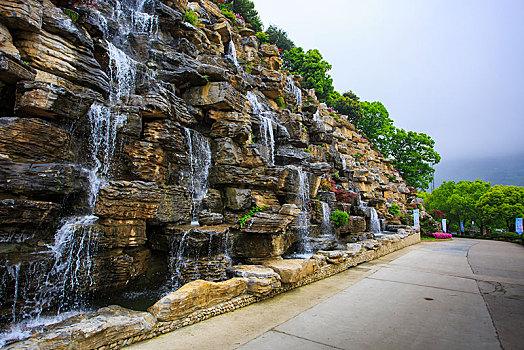 假山,瀑布,流水池塘天津植物园天津植物园园林小景吉林市瀑布假山景观