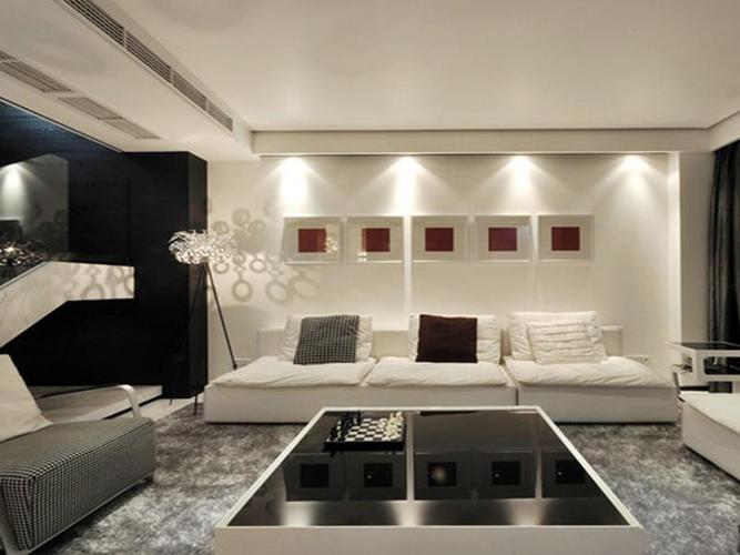 凹凸设计的多边形墙体与灯饰的效果心心相印,打造出温馨的客厅氛围