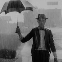 卓别林撑伞淋雨的图片卓别林淋雨伤感图片_微信头像图片大全